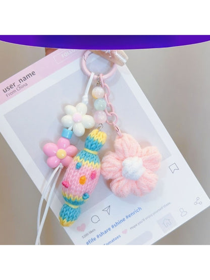 Handmade crochet candy shaped keychain in pastel colors with a metal keyring