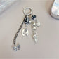 Silver simple dancing girl charm keychain on a white background