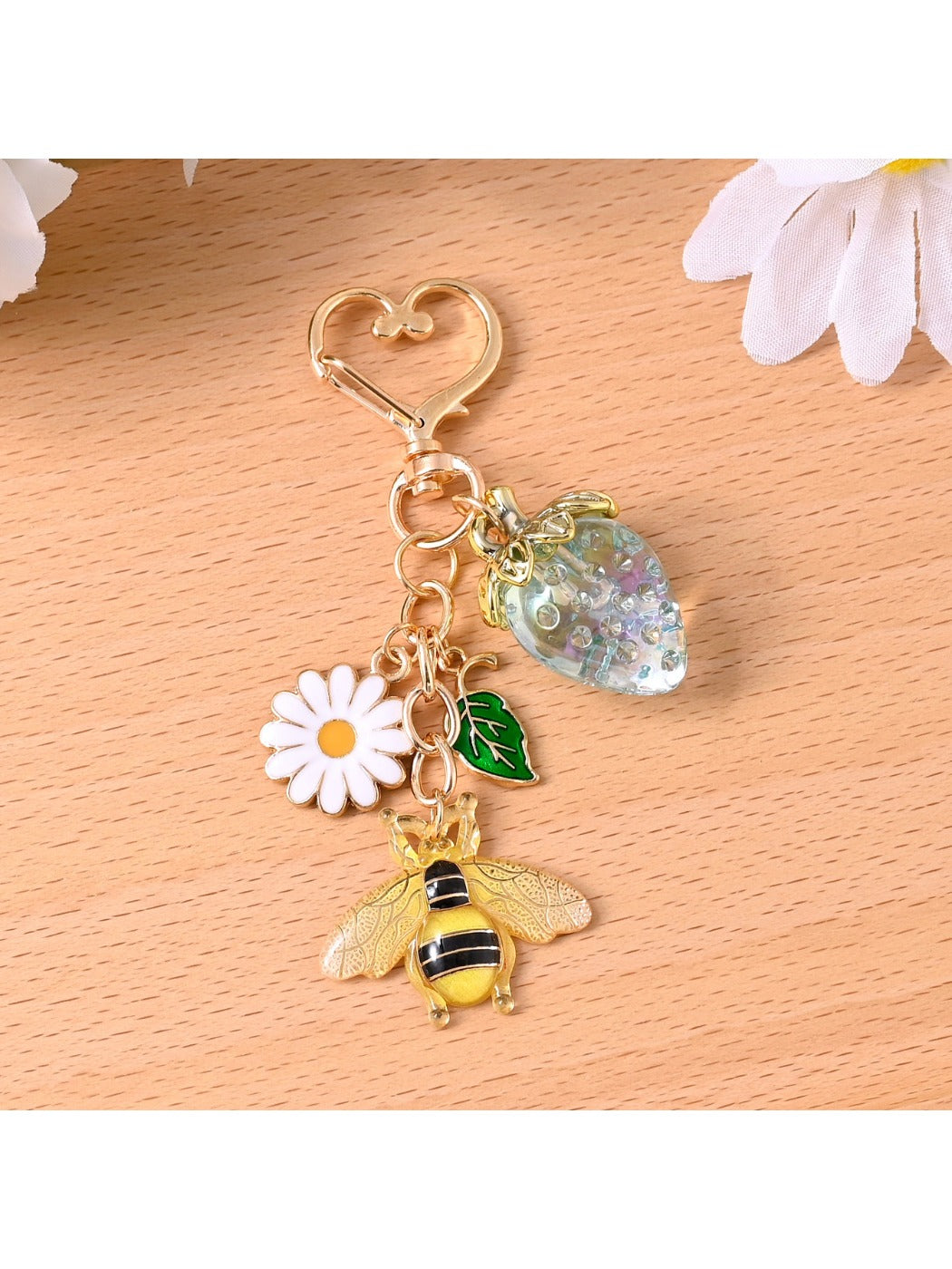 Side view of the alloy bee keychain showing its textured wings and body