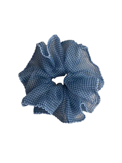 Close-up of blue plaid tulle scrunchie showing fabric details