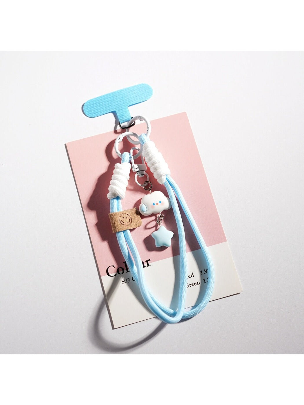 Cloud and star keychain displayed alongside other colorful accessories