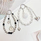 Close-up of Keypus beaded heart pendant keychain with pink and white beads