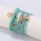 Lovra leaf pendant bracelet displayed with natural lighting emphasizing bead colors
