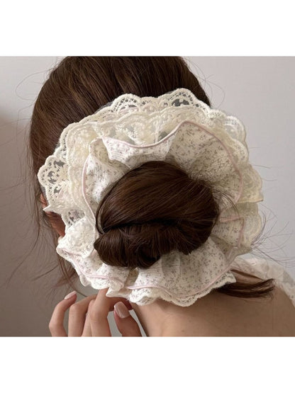 Gifty lace trim tiny floral scrunchie displayed on a white background