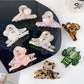 Beau colorful floral hair claw clip on white background showing front view