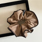 Scrunchie styled on a wrist as a fashionable accessory