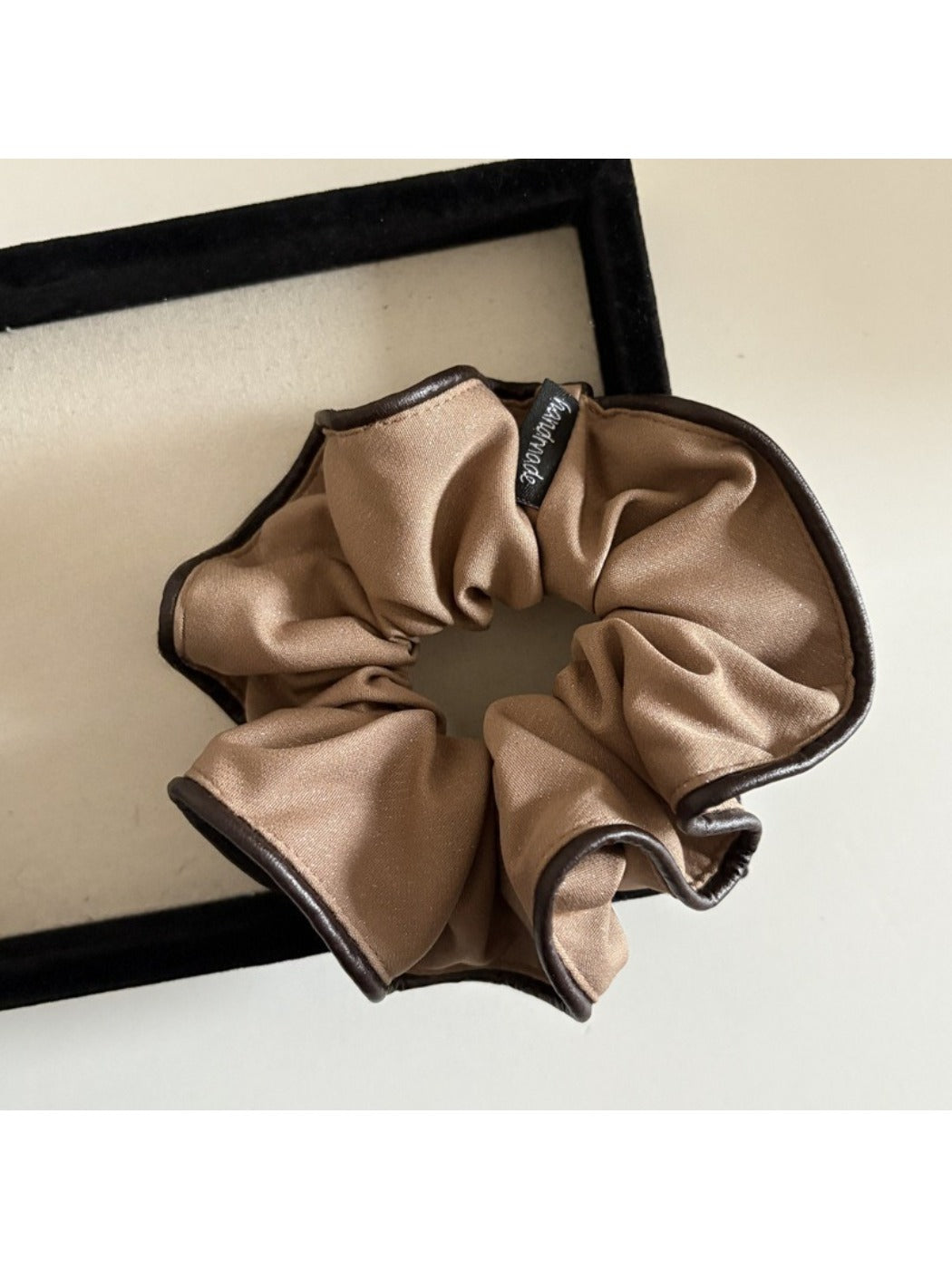 Scrunchie styled on a wrist as a fashionable accessory