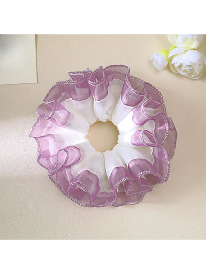 Side view of Gifty minimalist scrunchie showing layered tulle ruffles