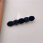 Beau rose decorated wavy hair clip packaged in clear box for retail