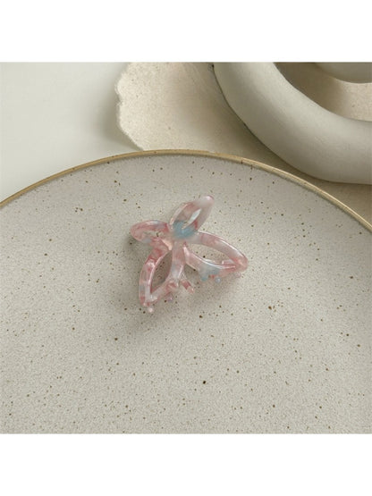 Beau acetate butterfly claw clip displayed with hair styled using the clip