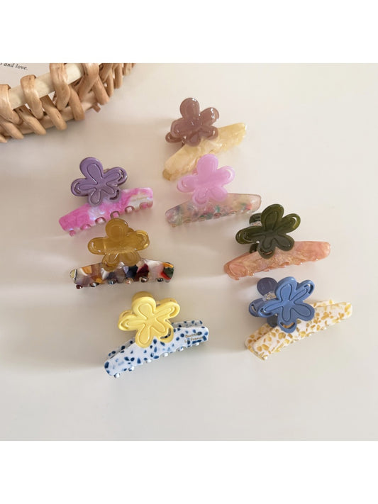 Close-up of Beau fresh acetate flower shaped hair clip in translucent pastel colors