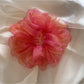 Model wearing the Gifty iridescent organza scrunchie in her hair
