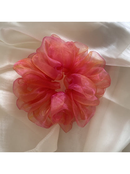 Model wearing the Gifty iridescent organza scrunchie in her hair