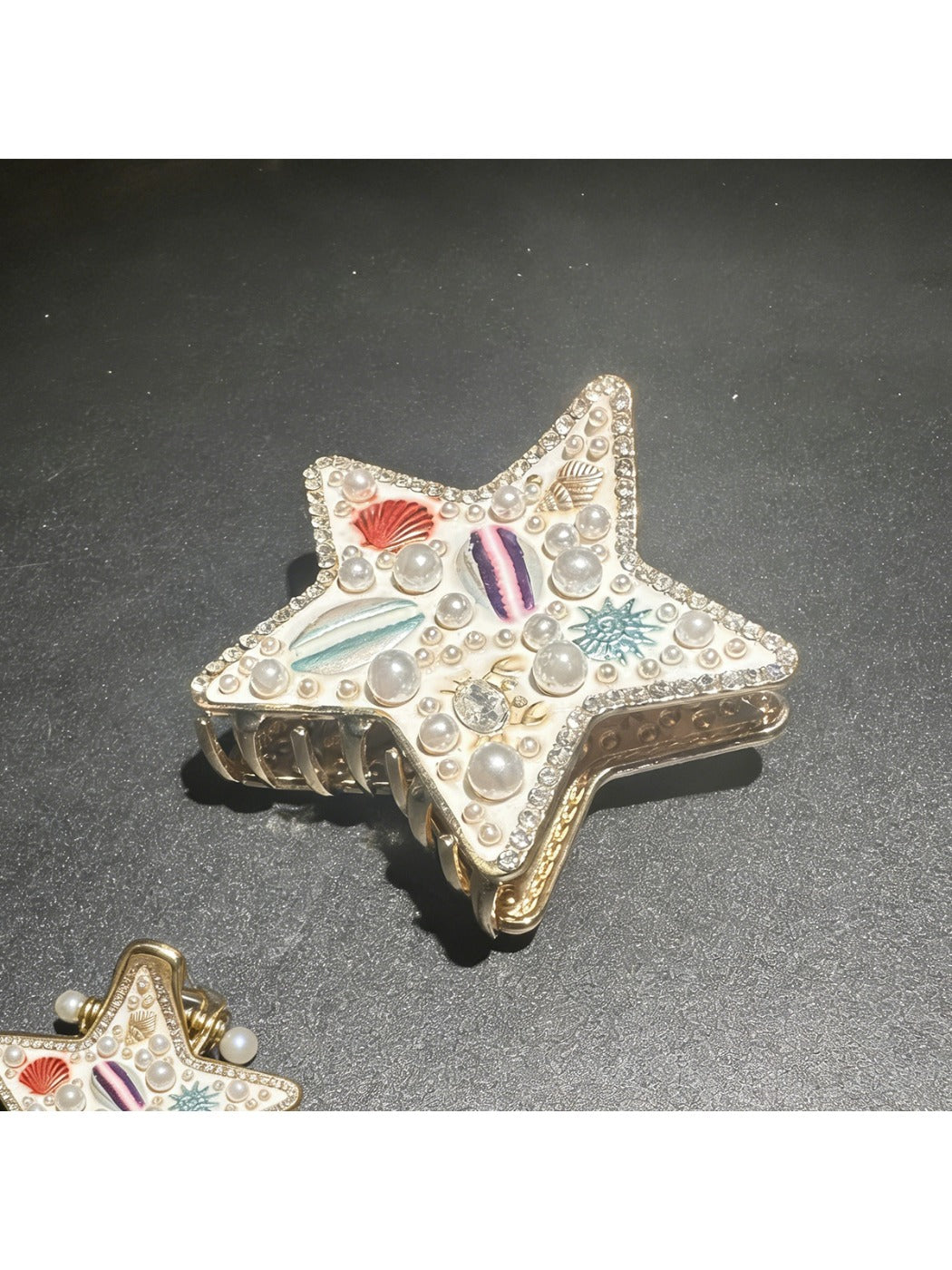 Beau beach style hair clip shown with matching beach accessories
