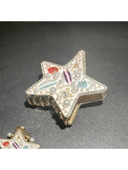 Beau beach style hair clip shown with matching beach accessories