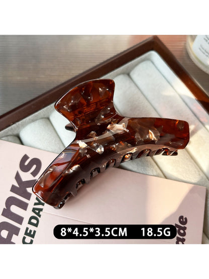 Beau claw clip shown alongside matching hair accessories on a neutral background