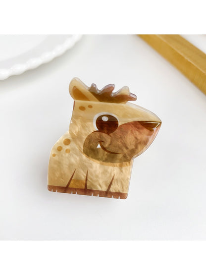 Beau bear shaped hair claw clip held in hand showing size and detail