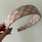 Top view of Gifty college style headband showing full patterned design