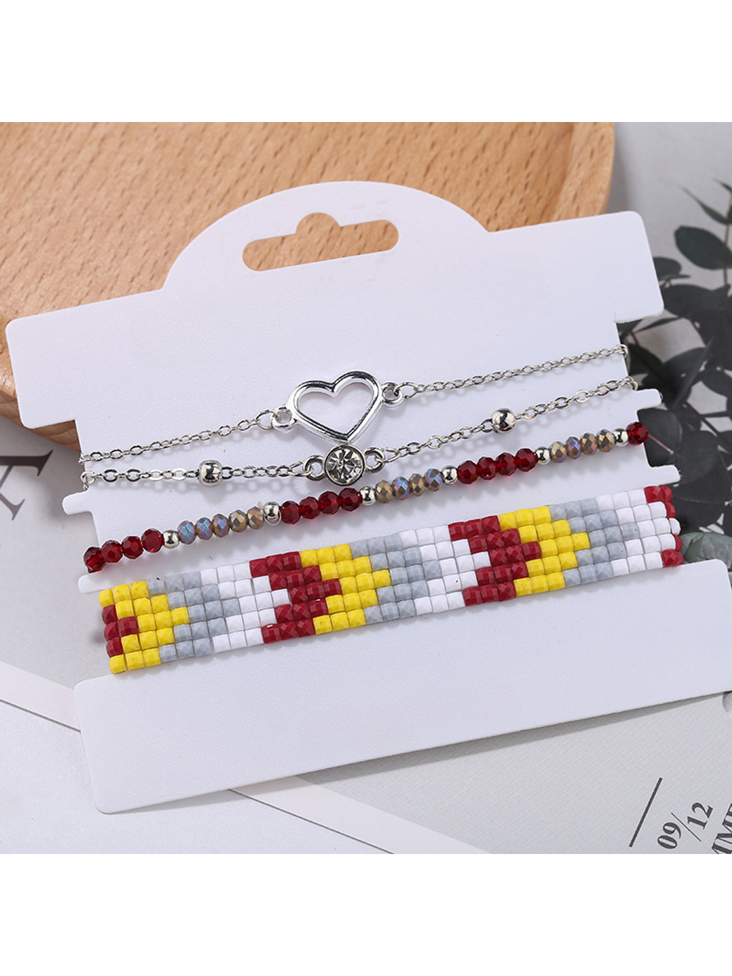 Lovra boho stackable beaded bracelets in natural shades displayed on a rustic background