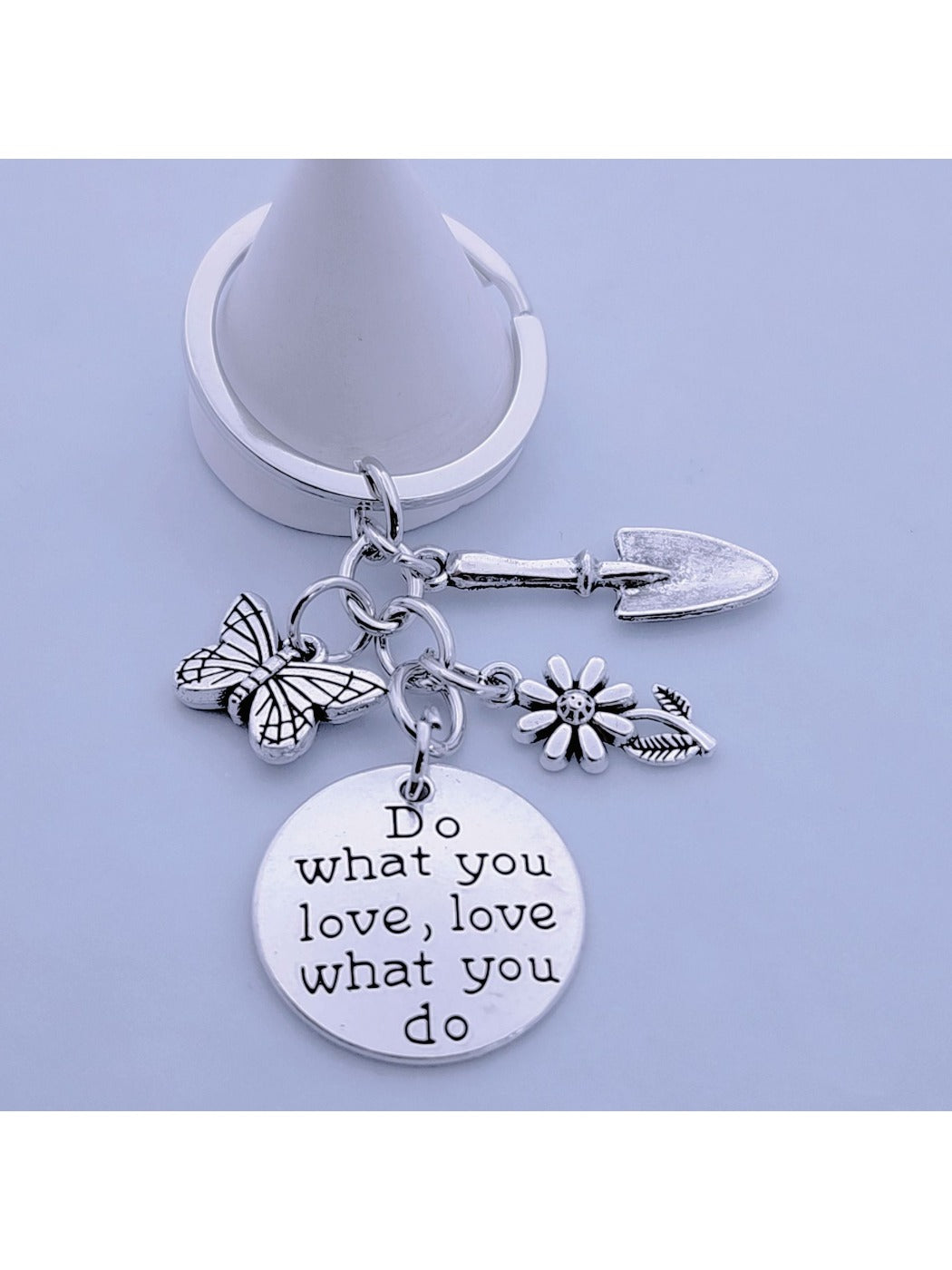 Butterfly flower keychain displayed on a white background with soft shadows