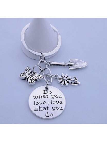 Butterfly flower keychain displayed on a white background with soft shadows