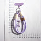 Close-up of cloud and star keychain showing smooth texture and metal ring