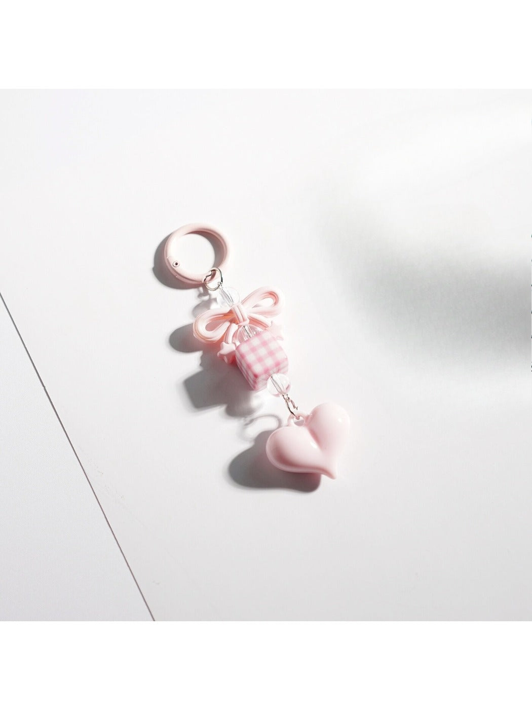 Side view of Keypus bow heart beaded keychain highlighting bead arrangement