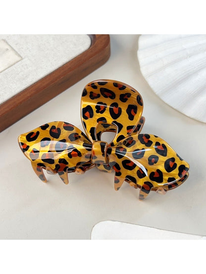 Beau bow claw clip open showing metal spring mechanism