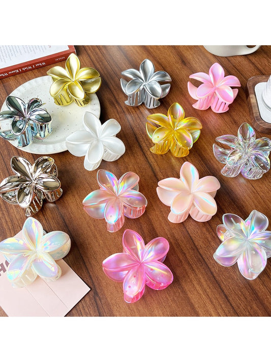Beau stylish flower shaped claw clip in soft pink on white background