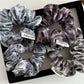 Close-up of Gifty Dreamy Silky Retro Scrunchie in soft pastel pink fabric
