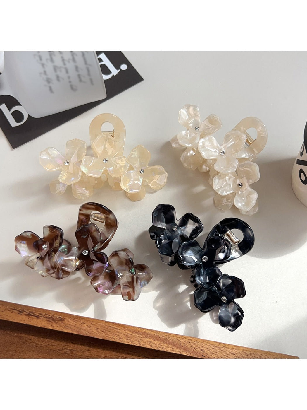 Side view of Beau elegant floral hair claw clip highlighting curved shape and clasp