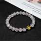Close-up of Lovra pastel beaded bracelet showing smooth round beads in muted colors