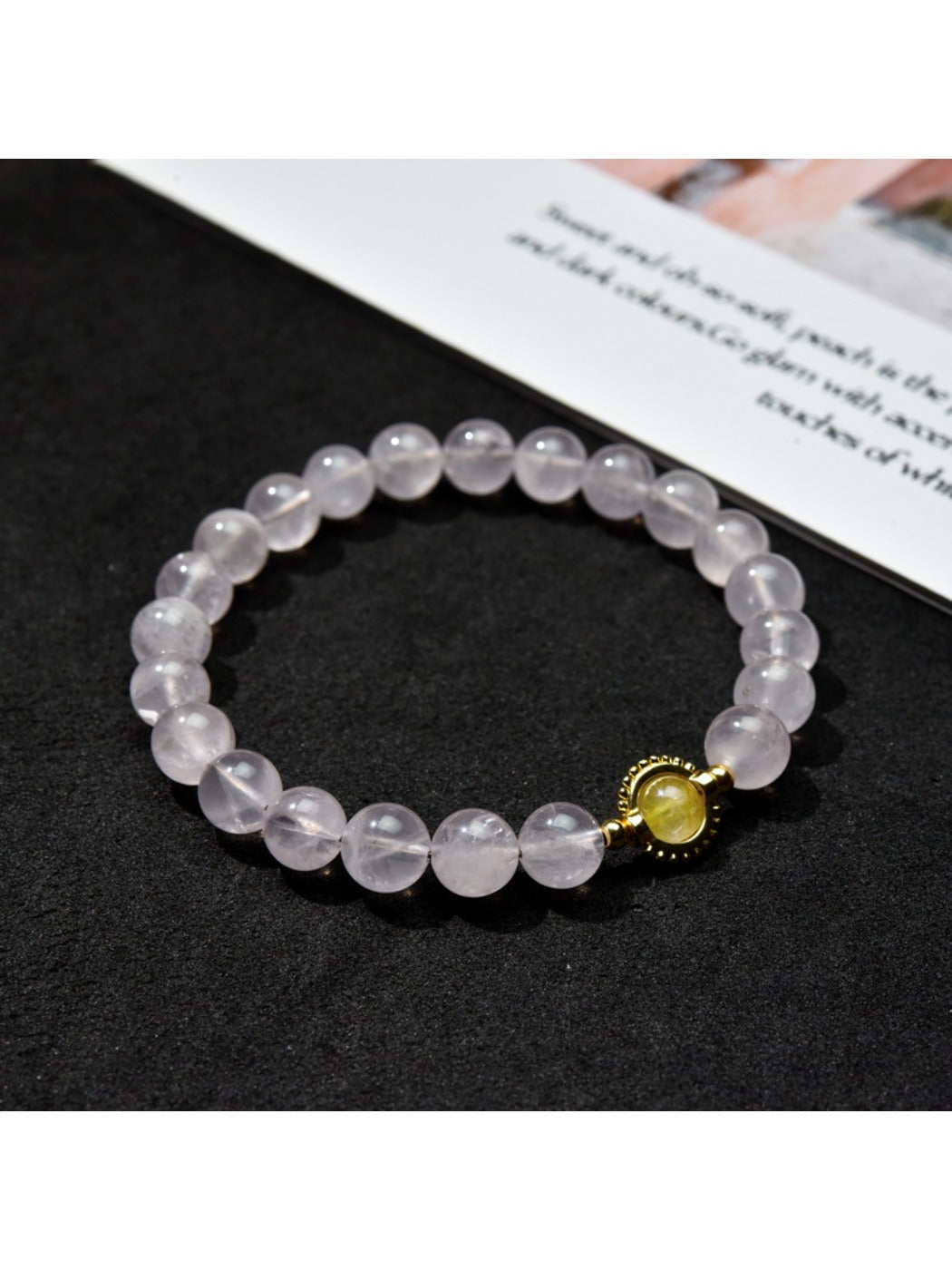 Close-up of Lovra pastel beaded bracelet showing smooth round beads in muted colors