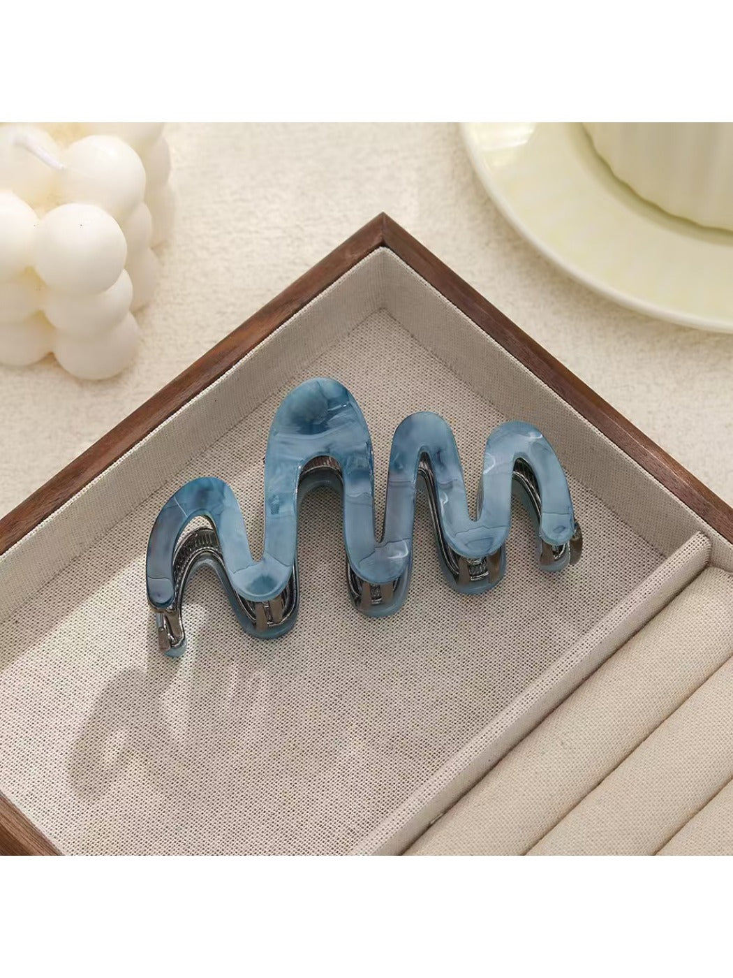 Beau elegant hair clip shown with packaging box and branding