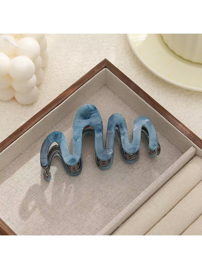 Beau elegant hair clip shown with packaging box and branding