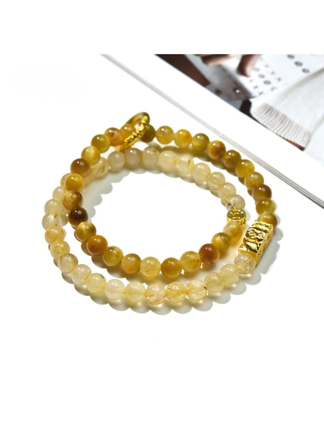Close-up of Lovra minimalist stackable beaded bracelet with small round beads on a wrist