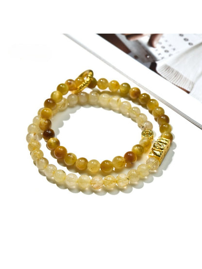 Close-up of Lovra minimalist stackable beaded bracelet with small round beads on a wrist