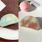 Beau colorful hair claw clip displayed with hair strands