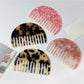 Side view of Camerow acetate hair comb showing thickness and shape