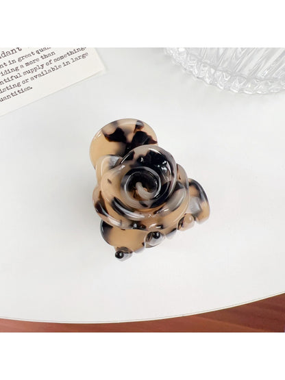 Top view of Beau Sweet Rose decorated hair claw clip showing rose and clip teeth