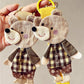 Front view of a cute fabric patchwork bear keychain with colorful stitched patterns