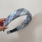 Side view of Gifty Sweet Plaid headband highlighting the wide edge and plaid pattern