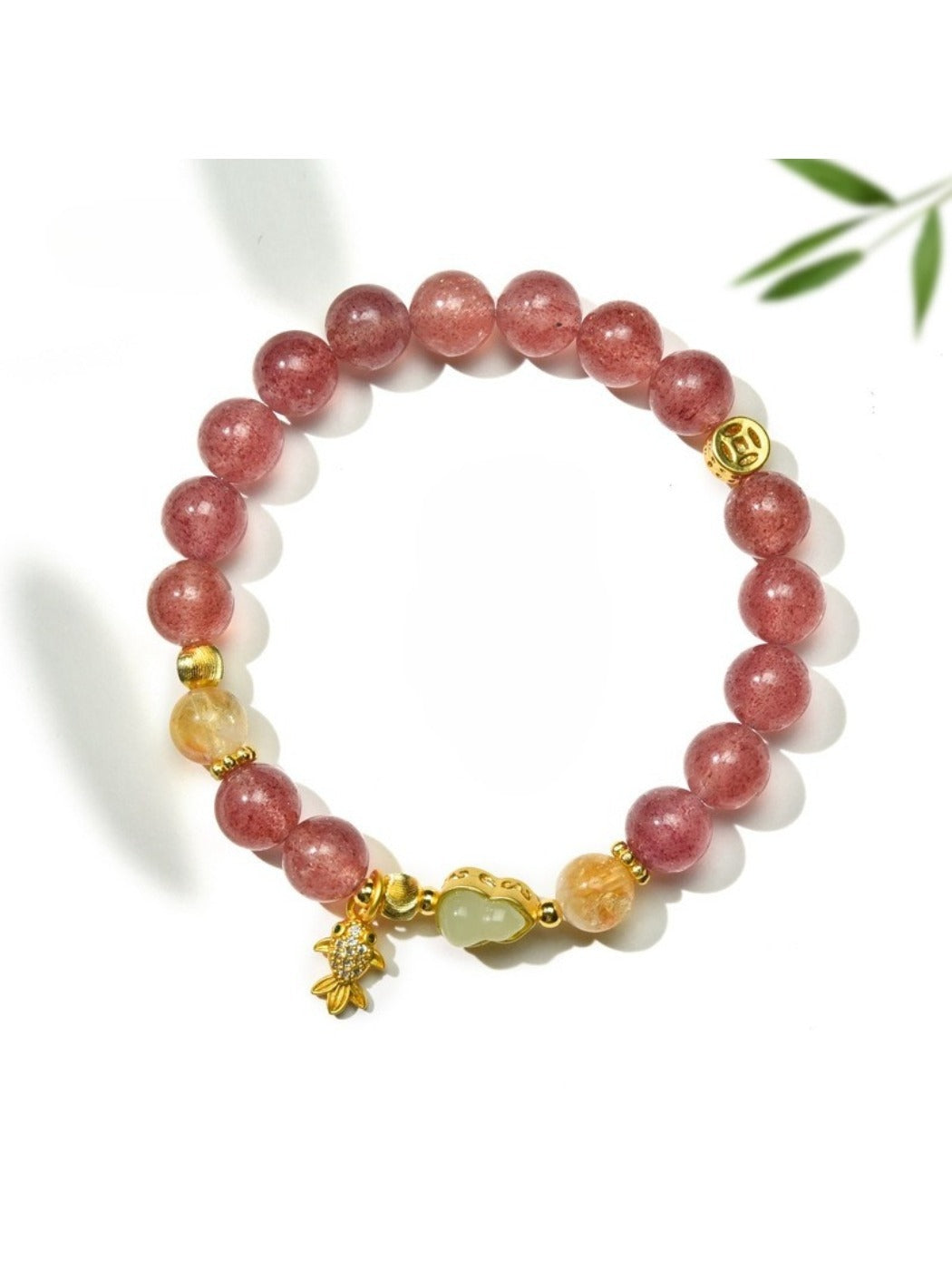 Lovra minimalist goldfish pendant on a delicate crystal bead bracelet
