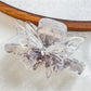 Beau butterfly decorated hair claw clip photographed with soft lighting