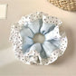 Gifty elegant scrunchie with color block design and white polka dots on navy blue fabric