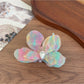 Beau acetate moth orchid claw clip held in hand showing size and shape