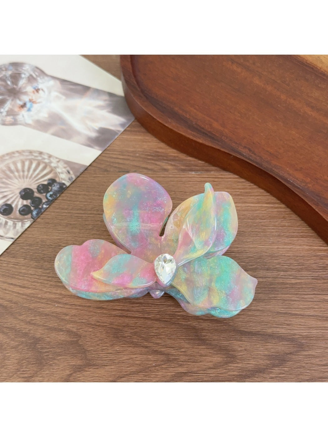 Beau acetate moth orchid claw clip held in hand showing size and shape