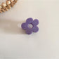 Top view of Beau natural flower hair clip showing symmetrical petal arrangement