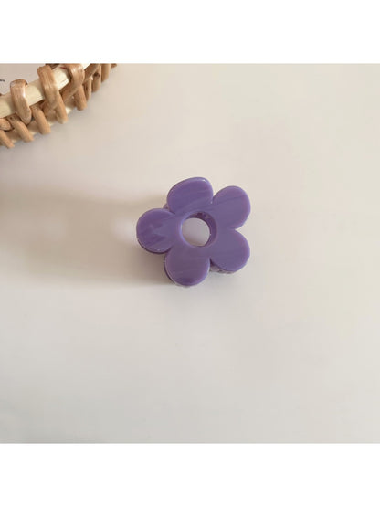 Top view of Beau natural flower hair clip showing symmetrical petal arrangement