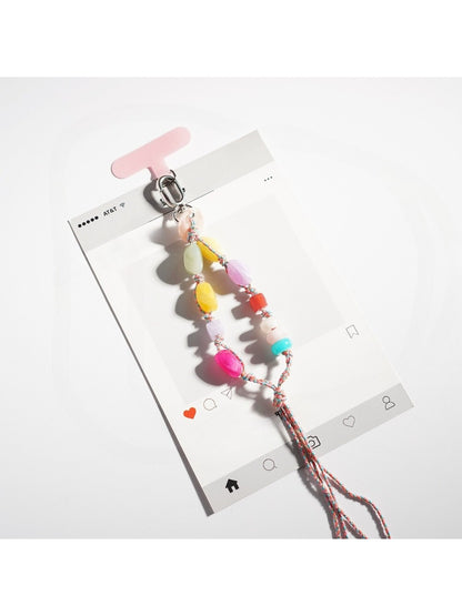 Flat lay of a resin bead keychain with bright, assorted beads